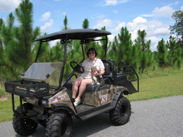 Teena Dobbs Newman driving her Stealth Predator, with cat Scooter, on her south GA pine tree farm.